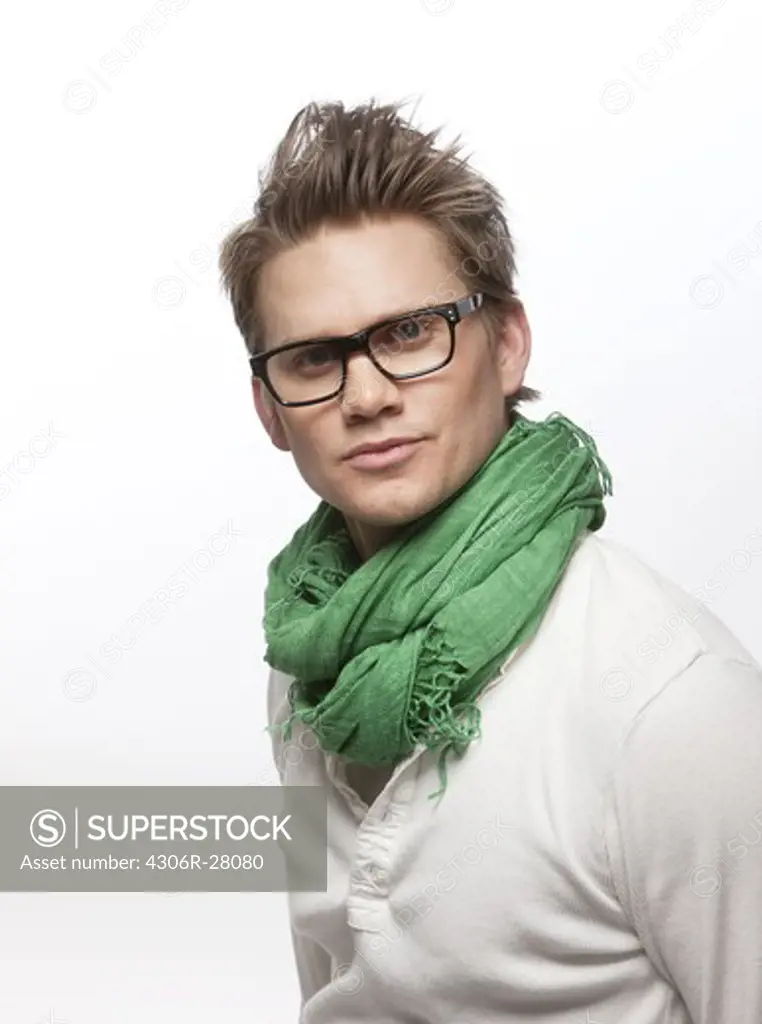 Studio portrait of young man wearing glasses