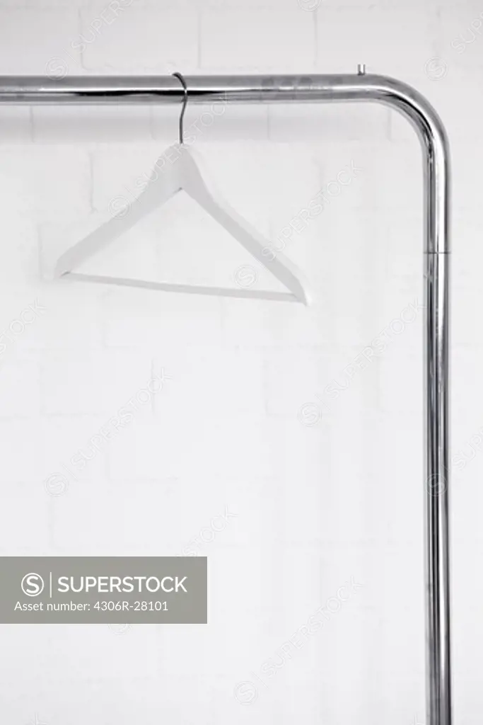 Clothes hanger hanging on clothes rail