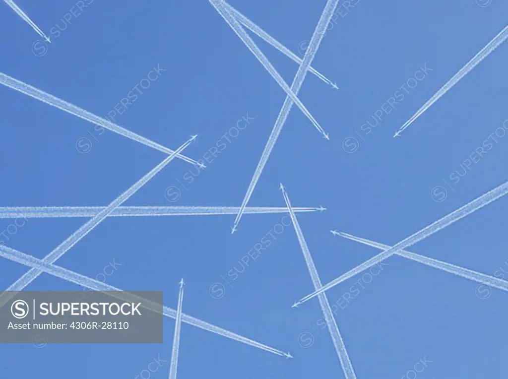 Airplanes against blue sky, directly below