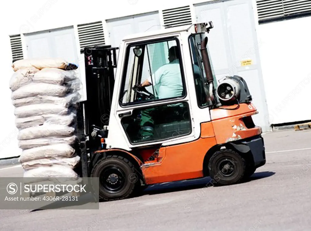 Forklift carrying bags