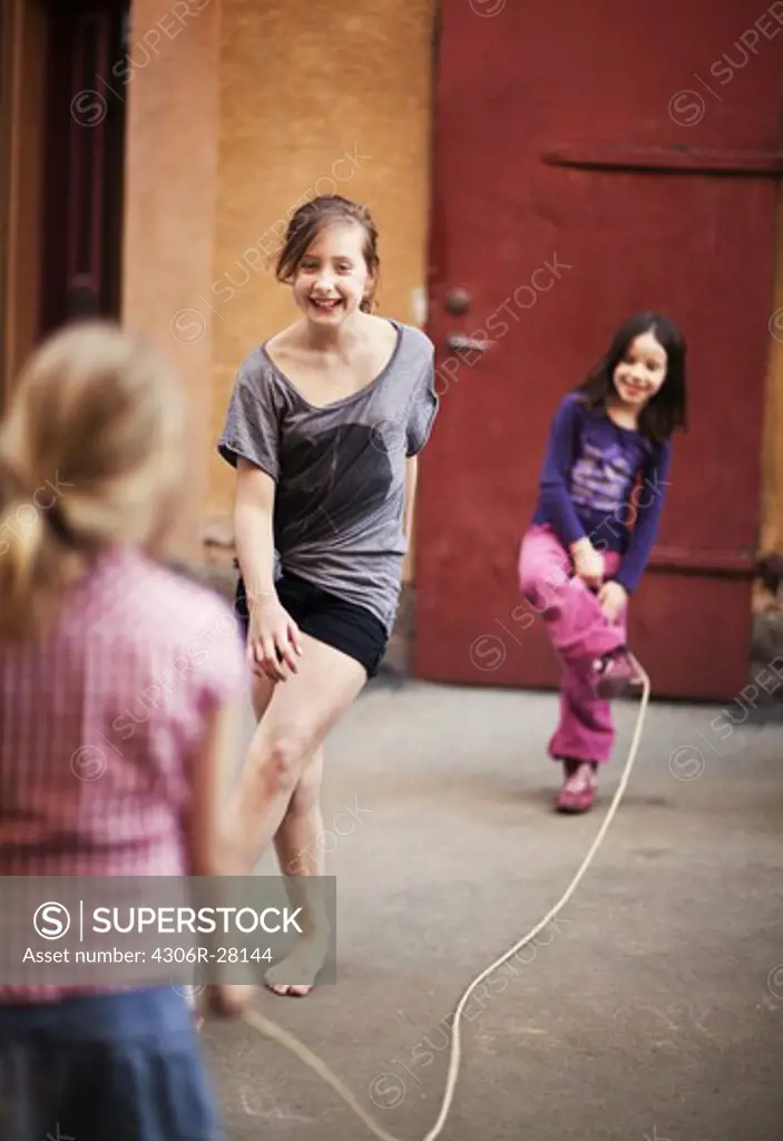 Girls skipping rope