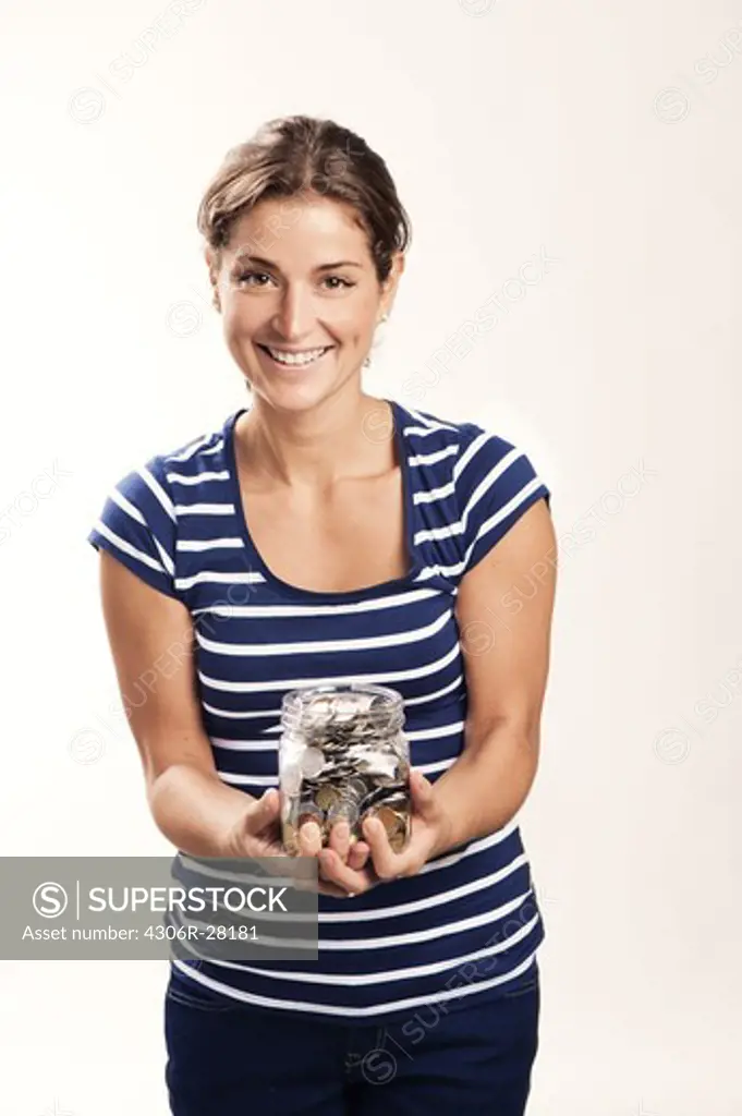 A woman with a jar filled with coins