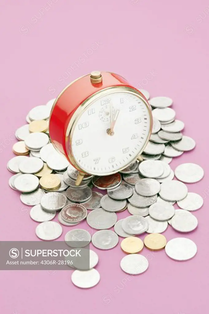 A alarmclock and coins