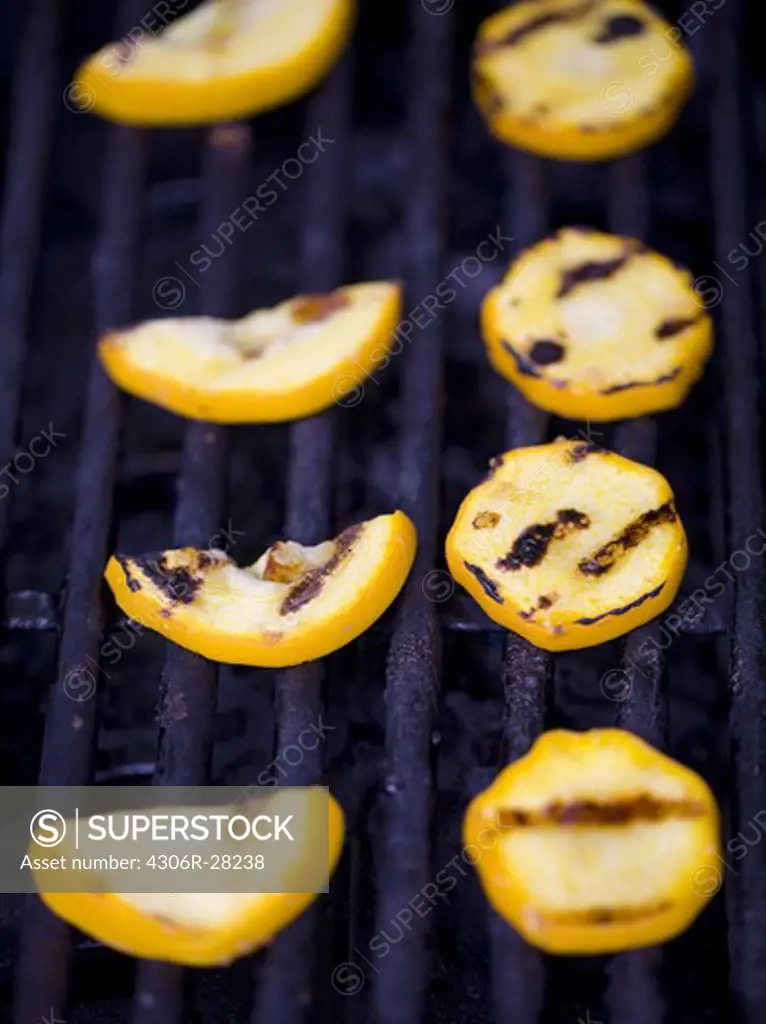 Slices of squash on barbecue grill