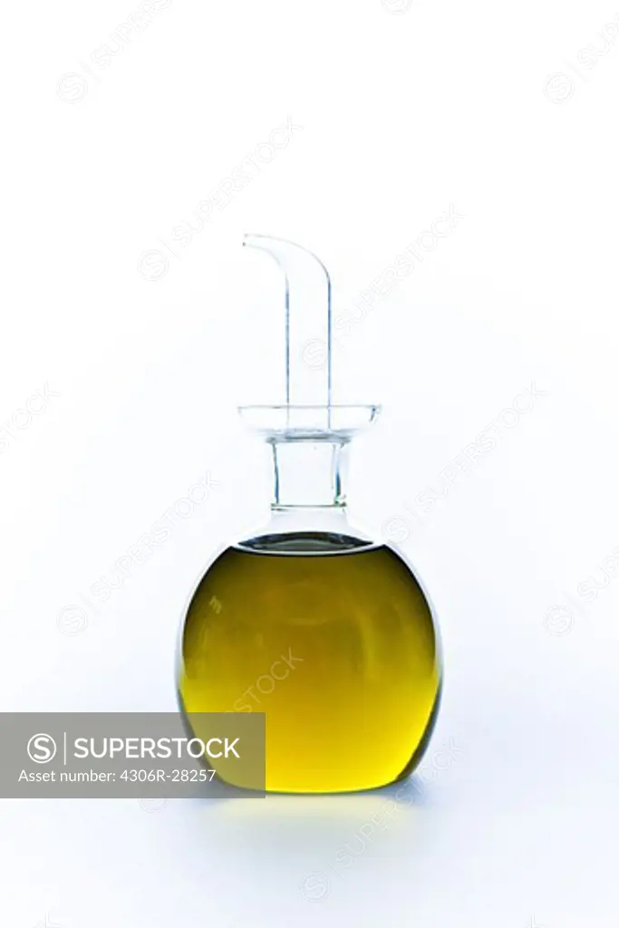 Close up of green lemonade in carafe on white background