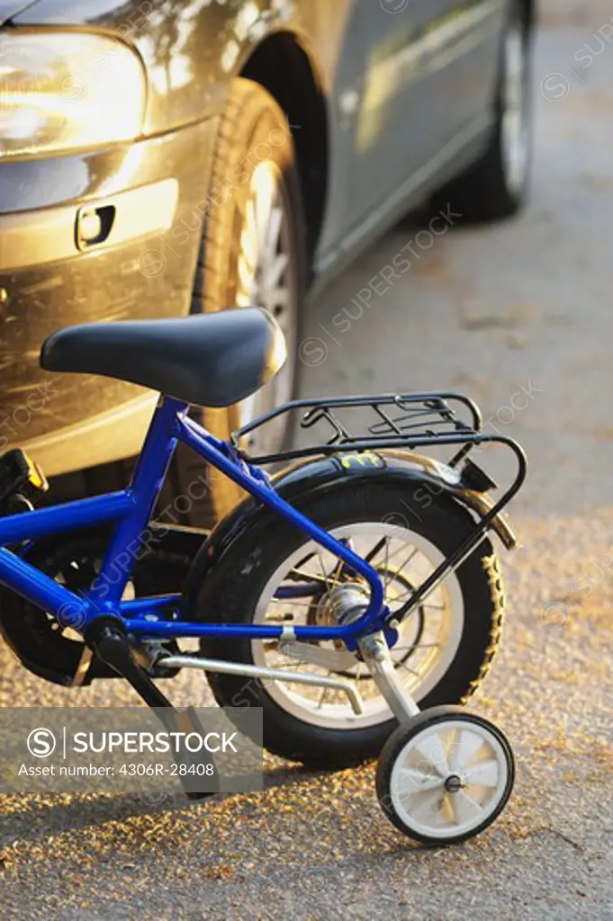 Close-up of childs bike with training wheels