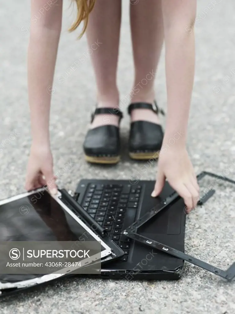 Girl with broken laptop