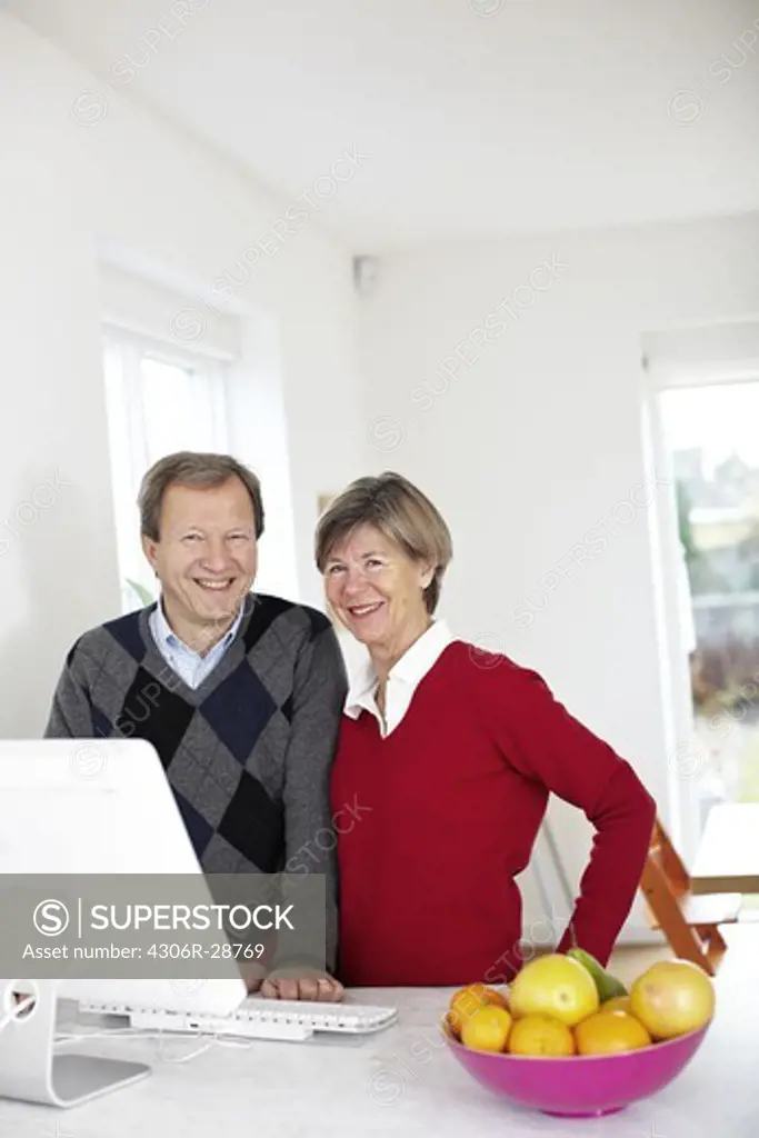Portrait of mature couple at home