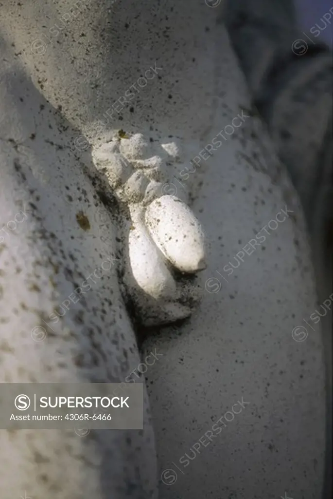 Genitals of male statue, close-up