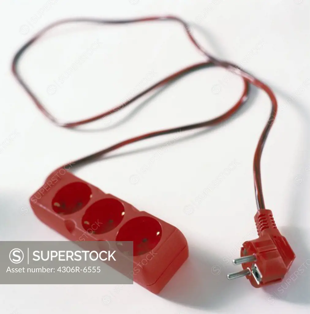 Red electric cord against white background