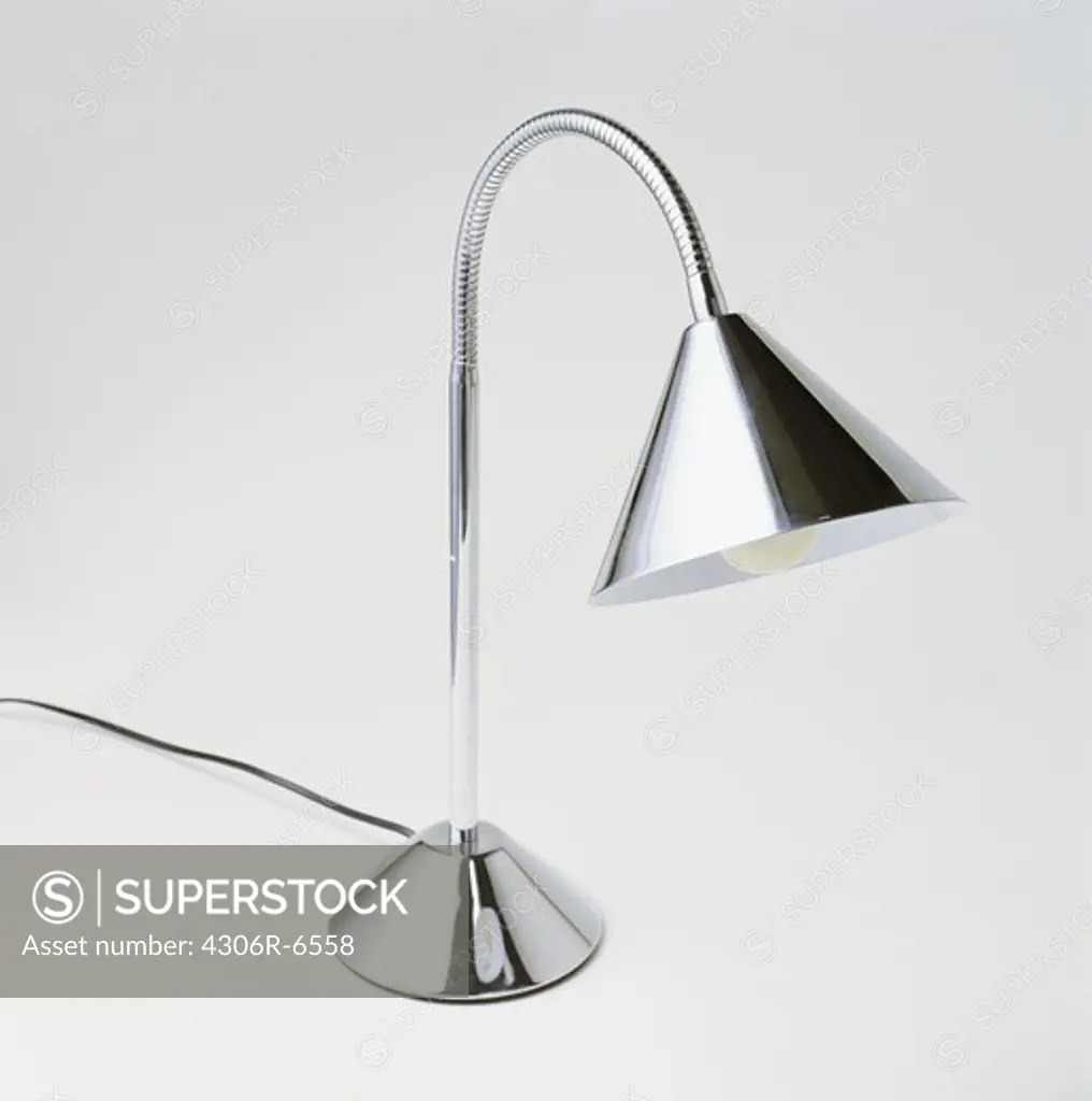 Steel electric lamp against white background
