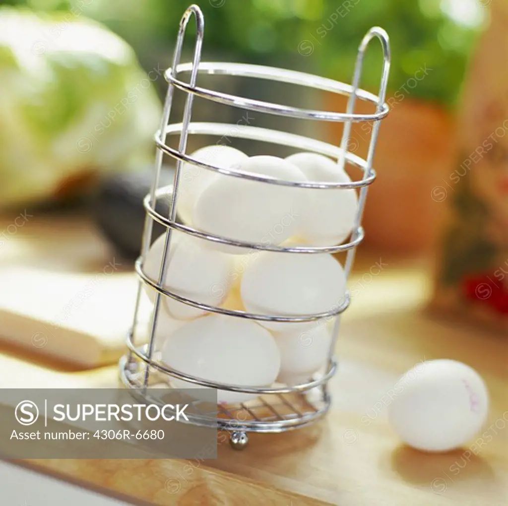 Raw eggs inside wire container