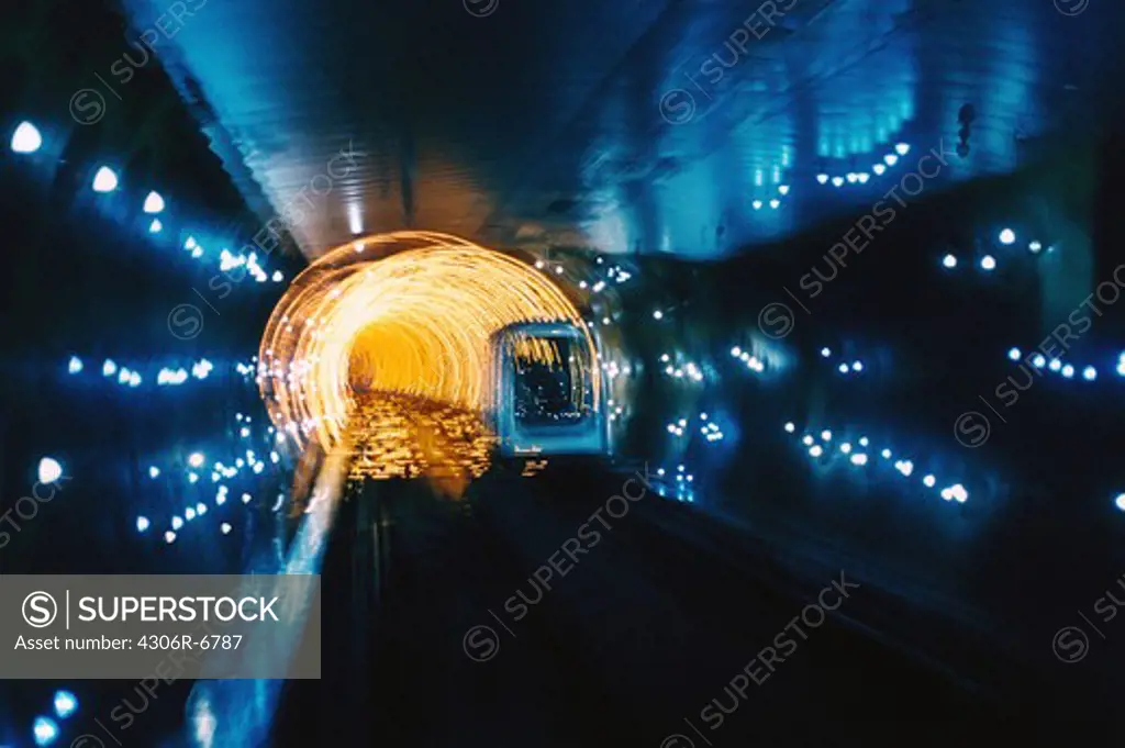 Vehicle in motion inside tunnel