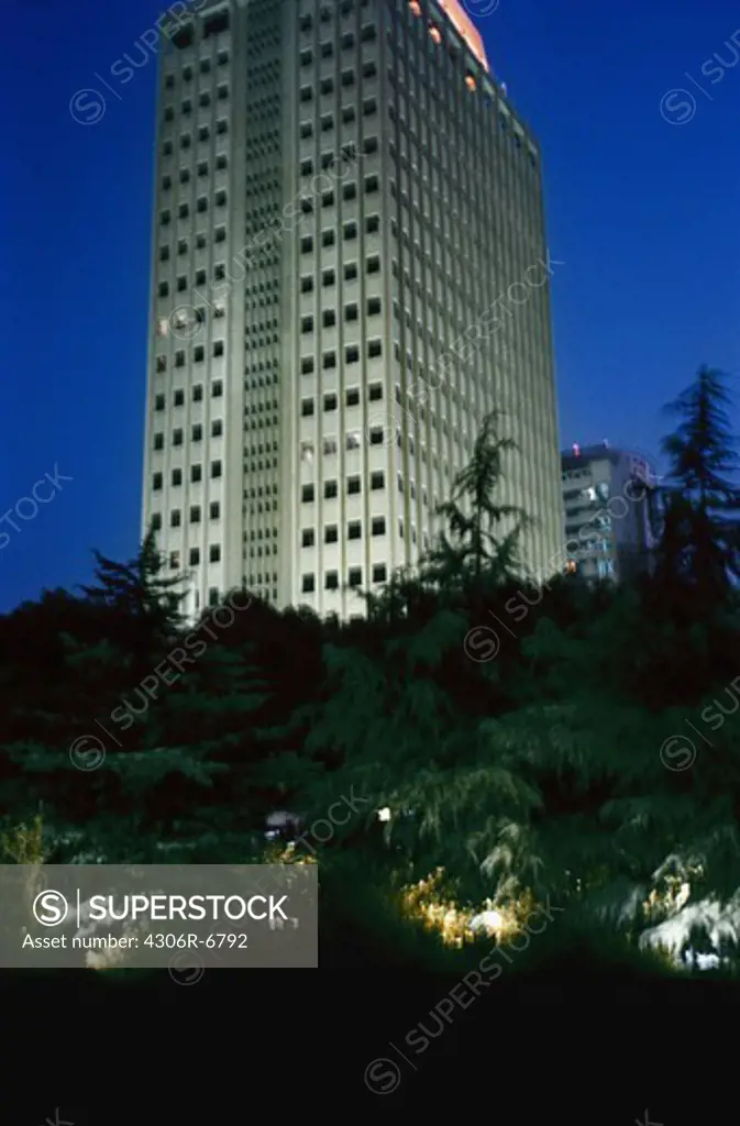 Multistorey building with trees in foreground