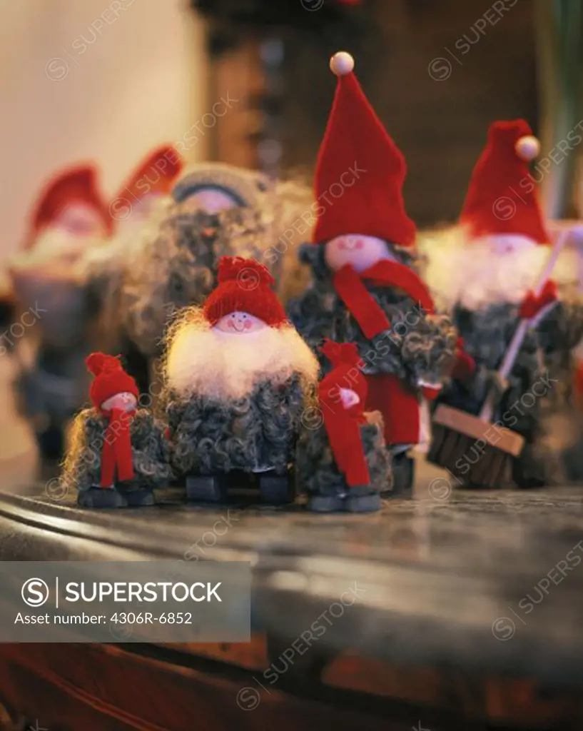 Santa Claus figurines on top of shelf