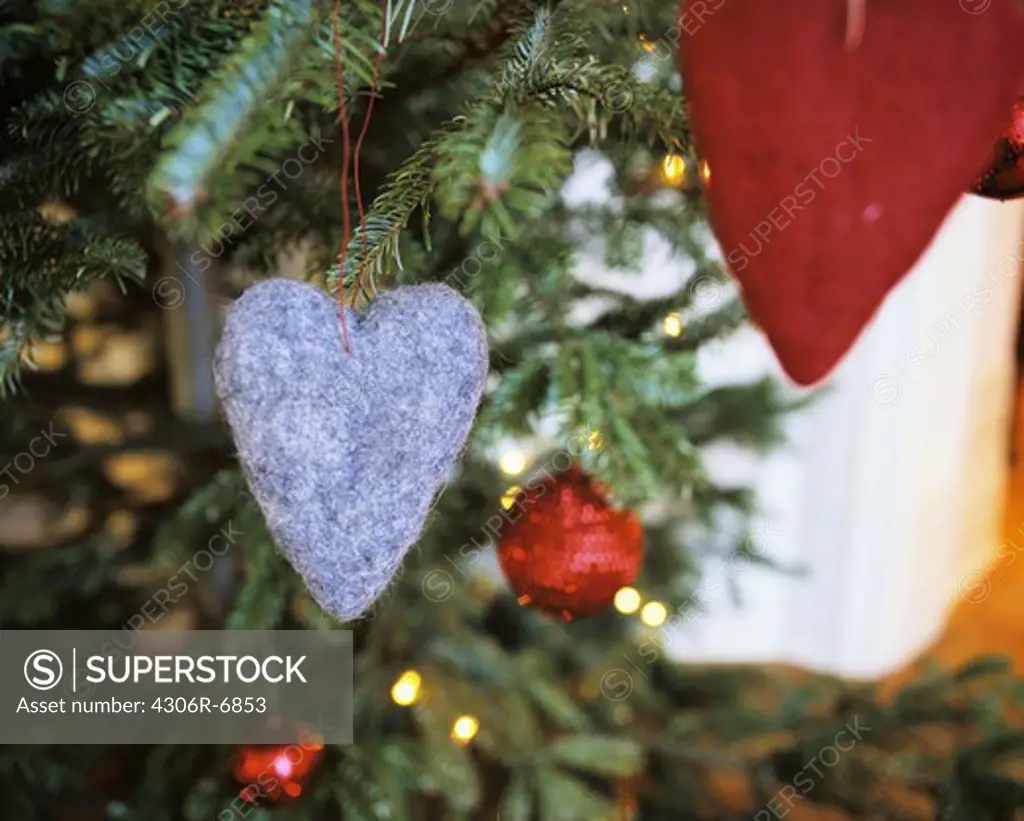 Heart shaped felt ornament on Christmas tree