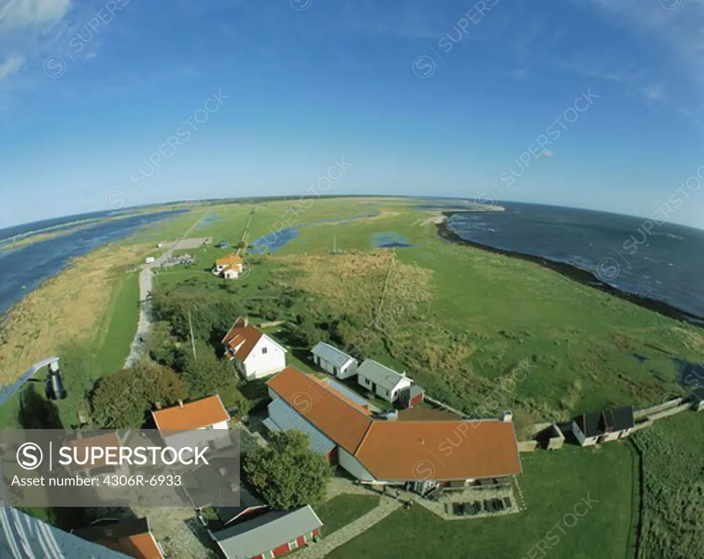 Aerial view of houses beside sea