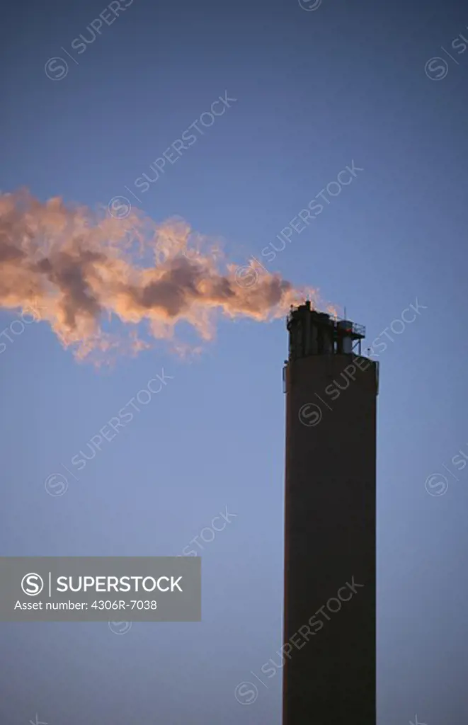 Factory emitting smoke from chimney