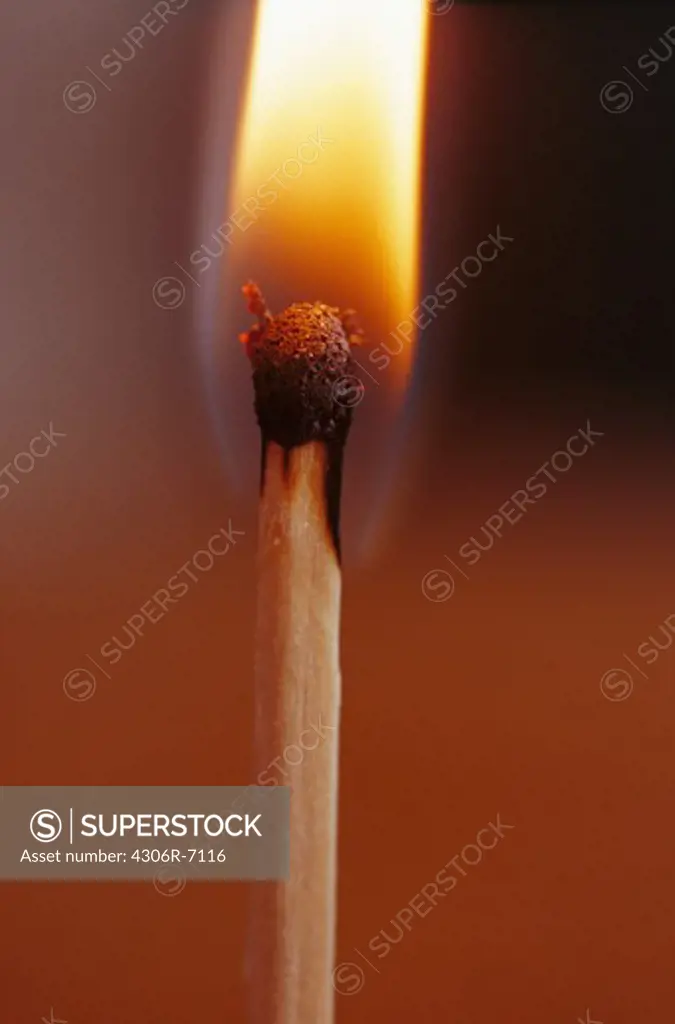 Close-up of flaming match stick