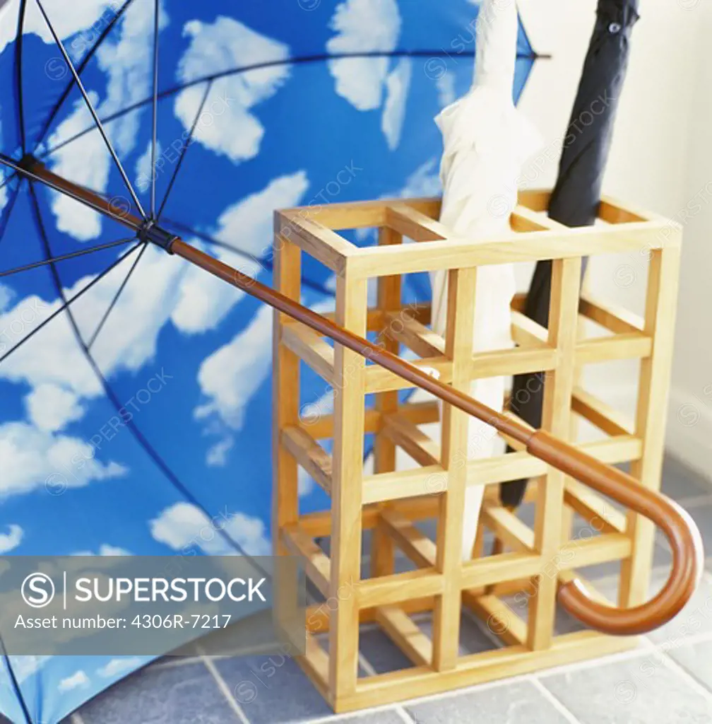 Wooden rack with umbrellas