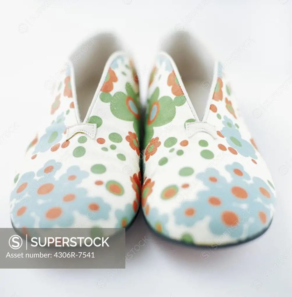 Pair of flower patterned shoes, close-up