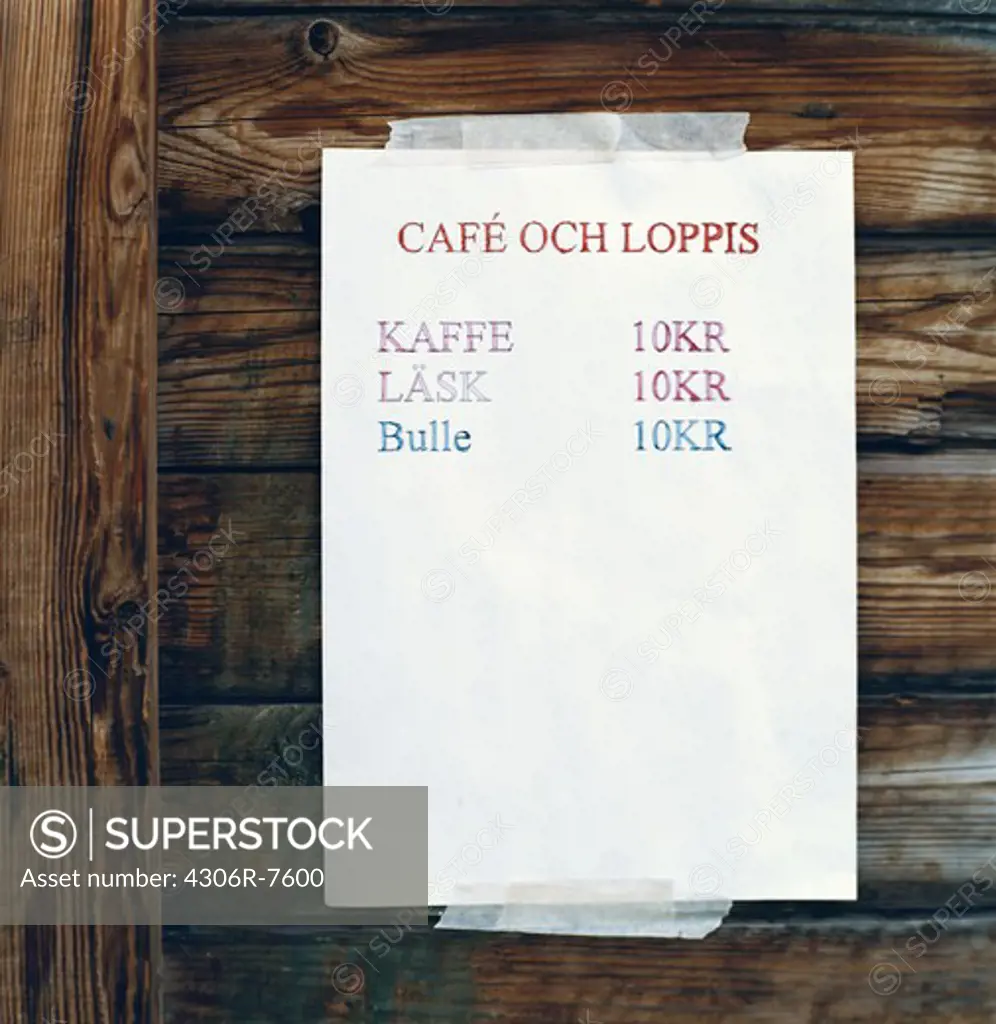 Cafe menu card displayed on wooden wall
