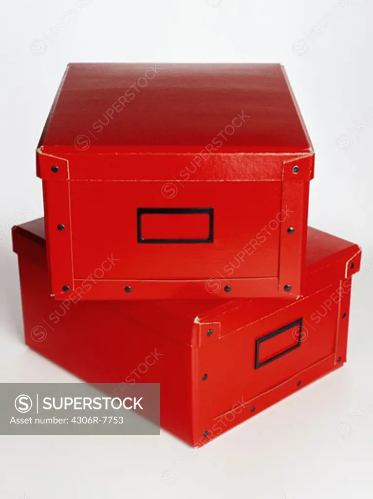 Two red drawers against white background, close-up