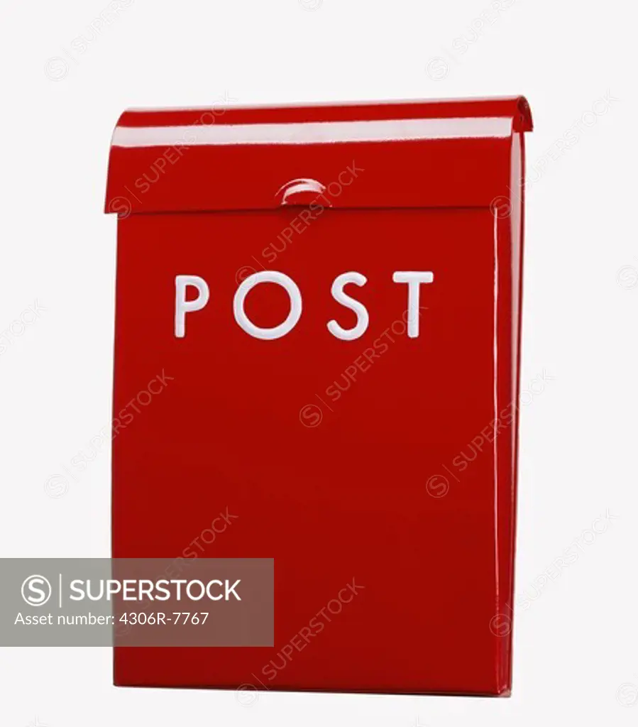 Red mailbox against white background, close-up