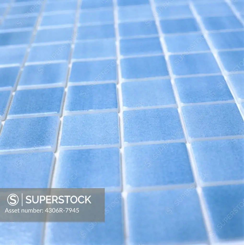 Blue tiles in swimming pool, close-up