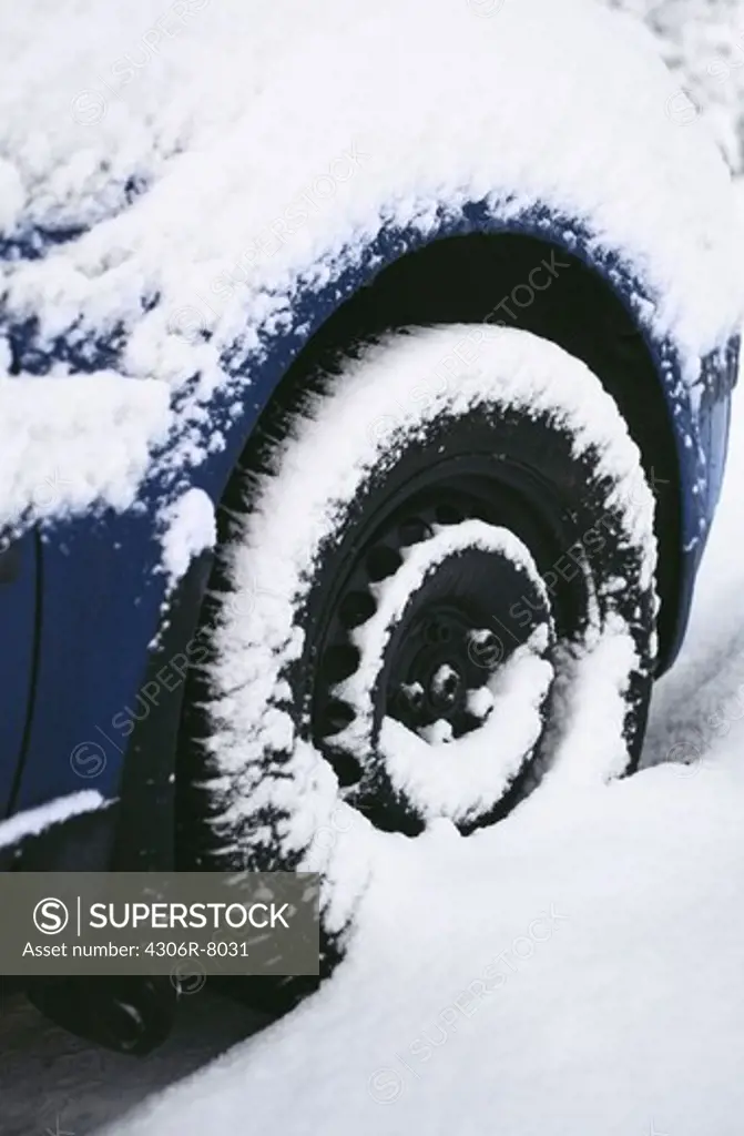 Close-up of tyre covered with snow