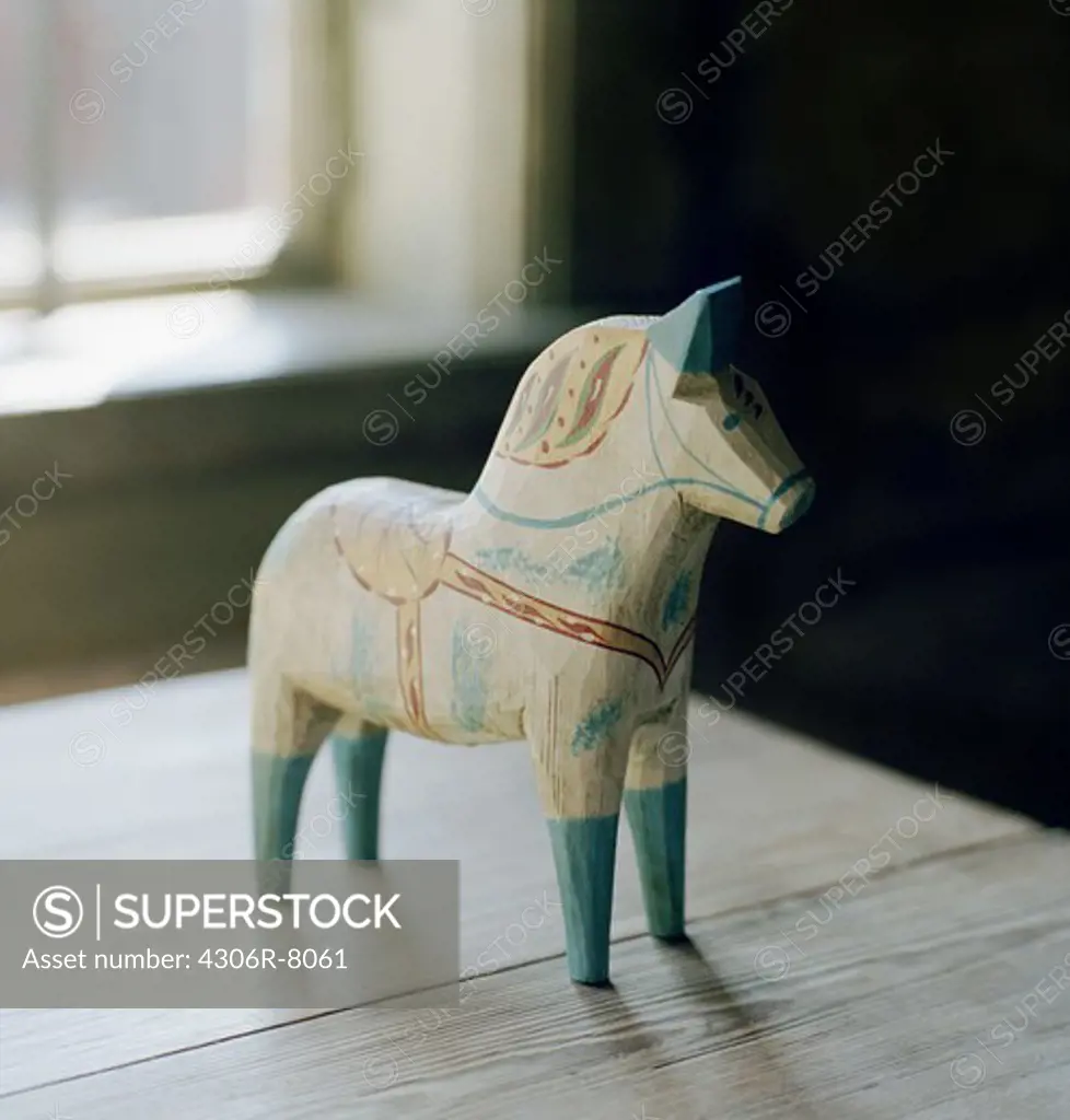 Dalecarlian horse on wooden table