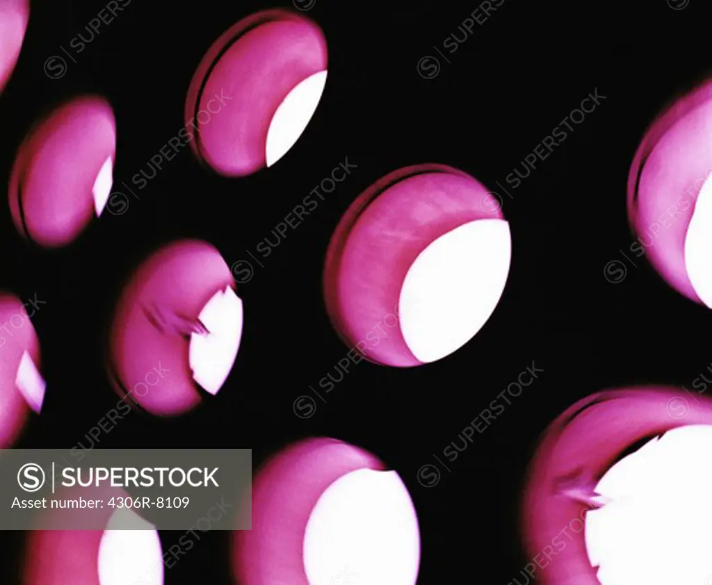 Close-up of pink round holes on wall