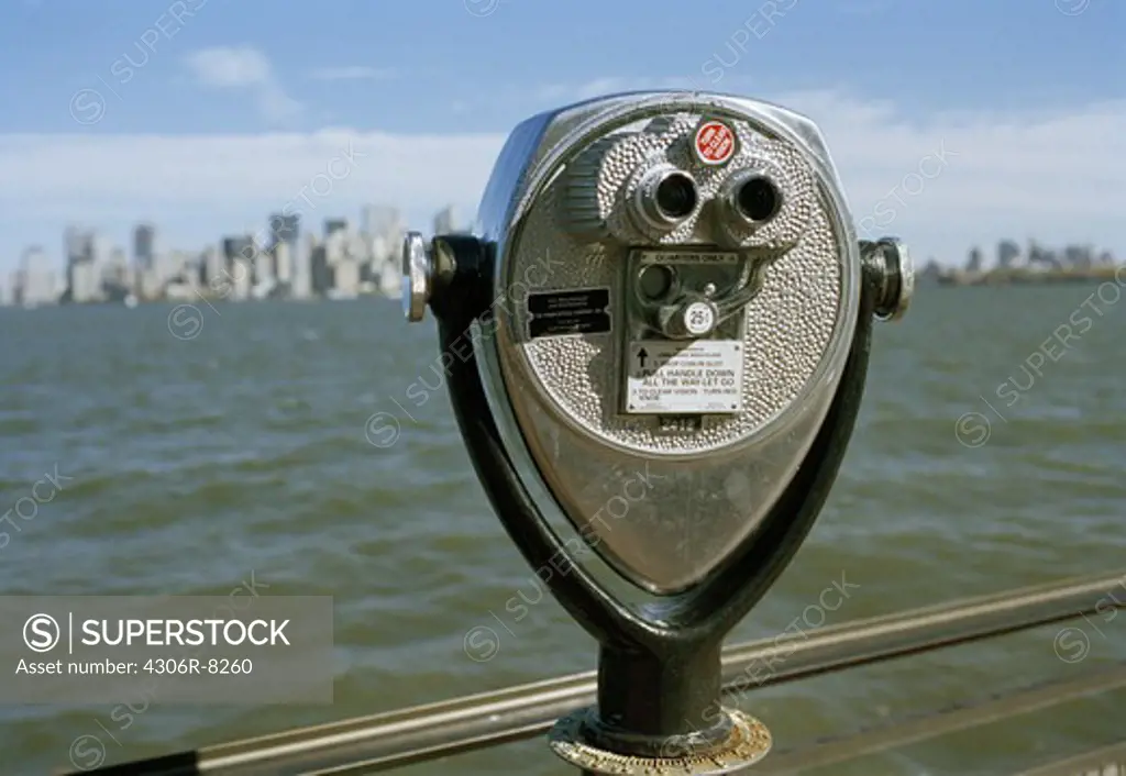 Coin operated binocular beside sea