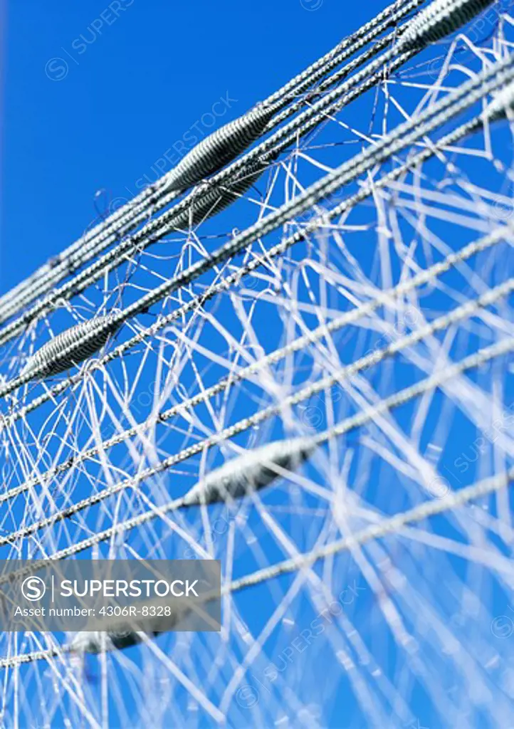 Close-up of fishing net against clear sky
