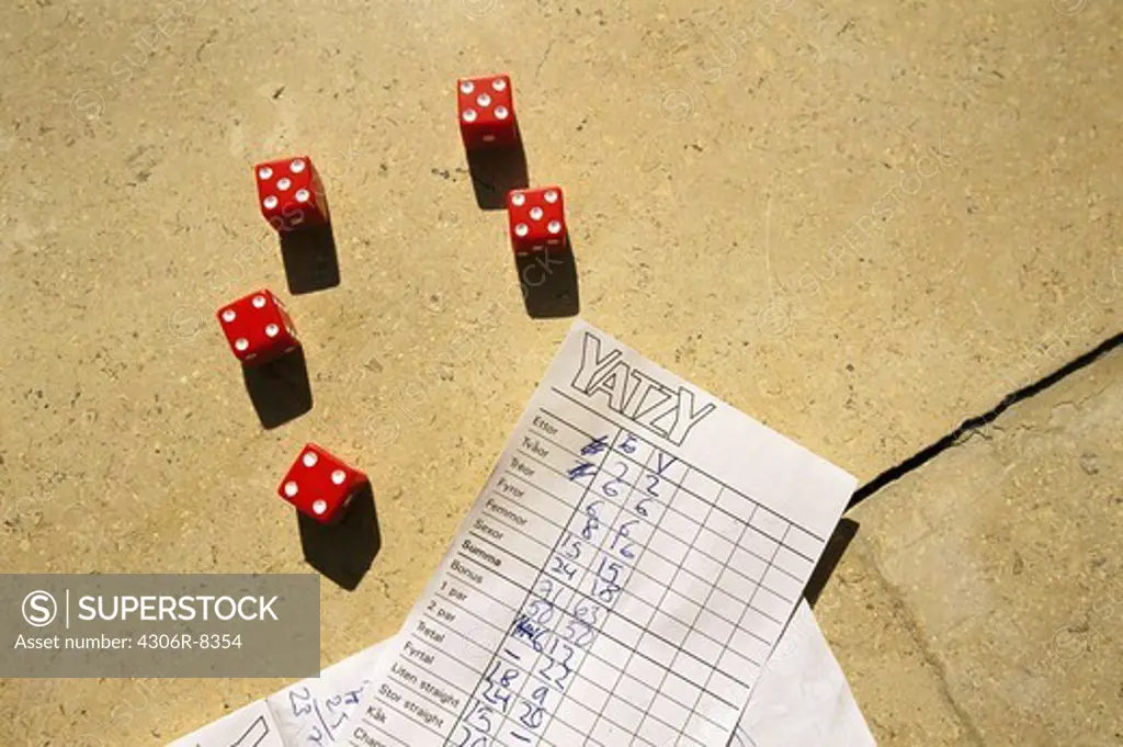 Red dices with yatzy score sheet