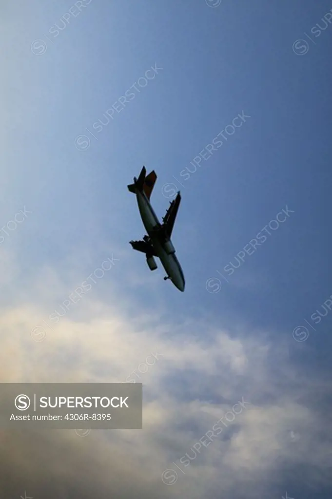Aeroplane flying against sky