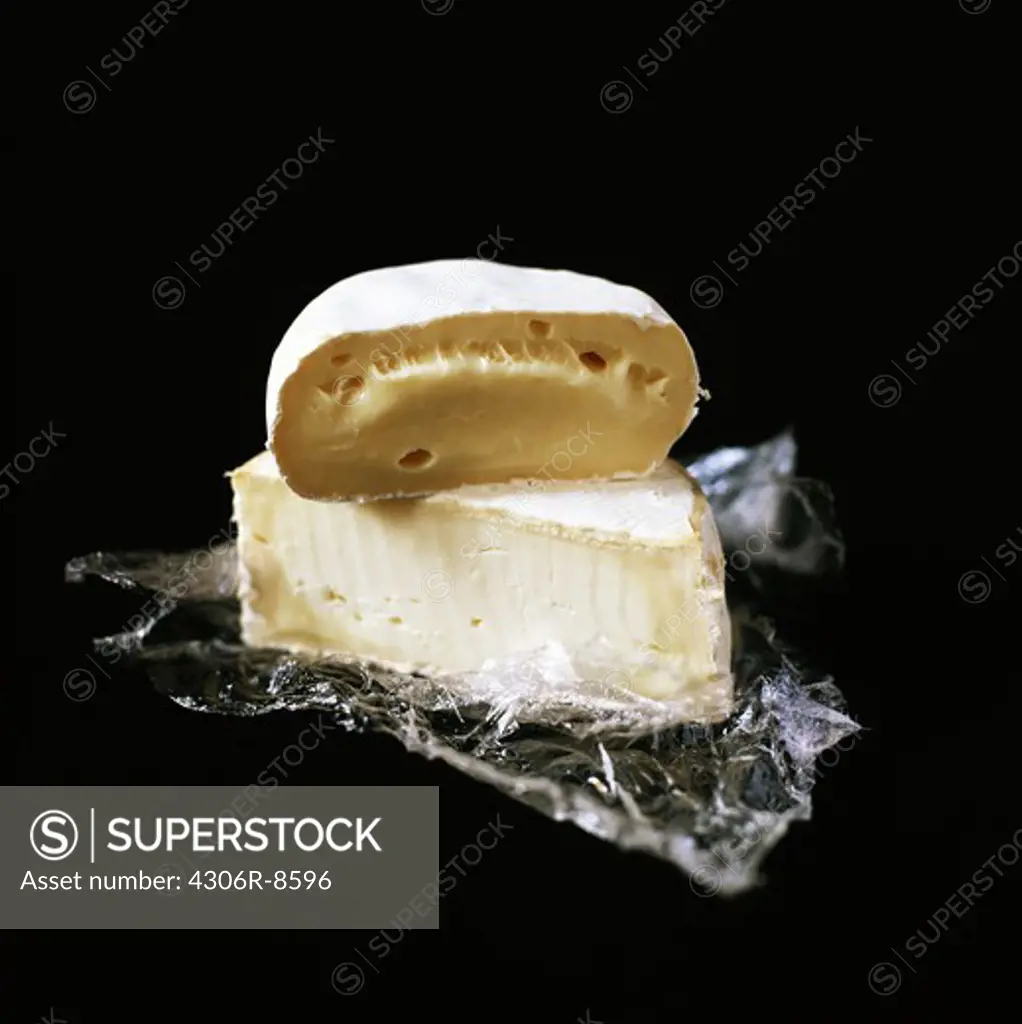 Dessert cheeses on a black background.