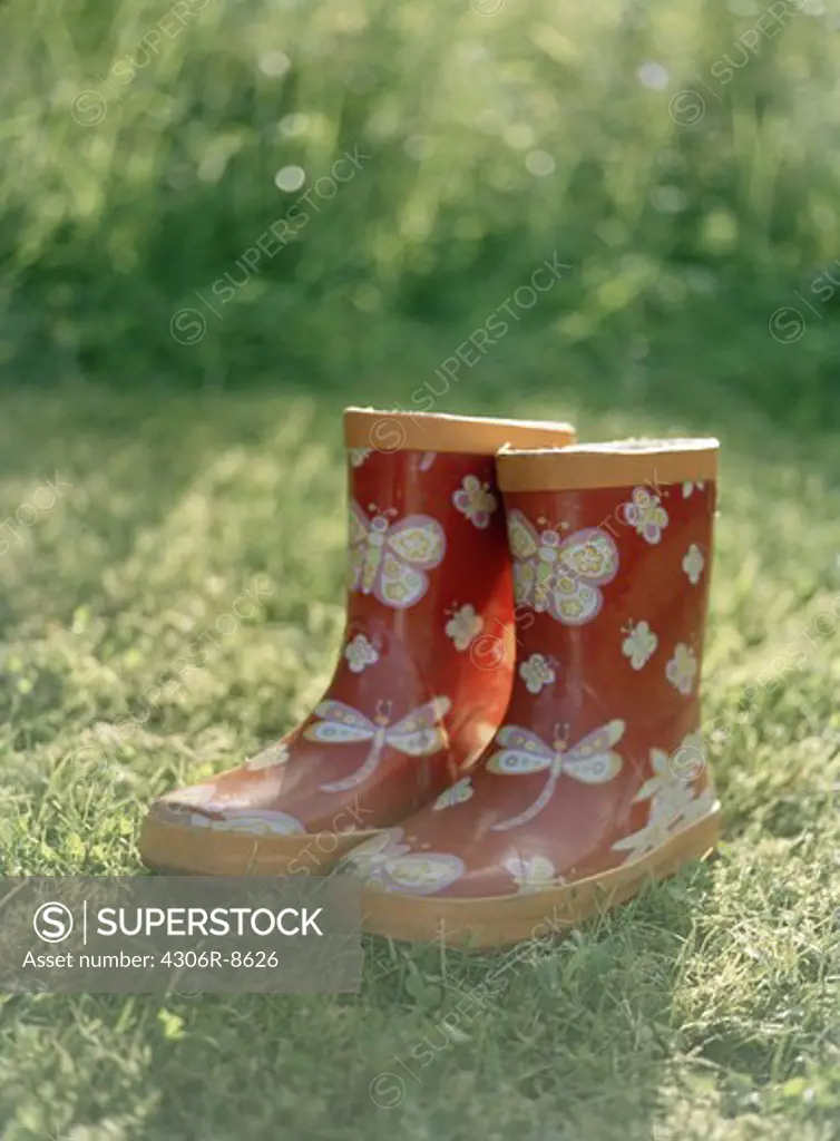 Pair of child's wellington boots in lawn