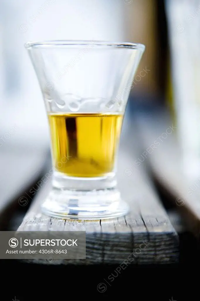Close-up of beer glass on wooden table
