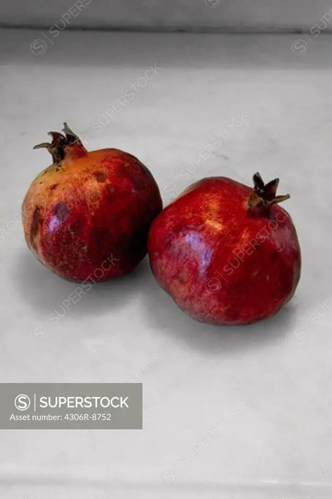Two pomegranates, close-up.