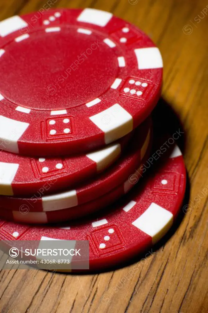 A pile of red gambling marks, close-up.