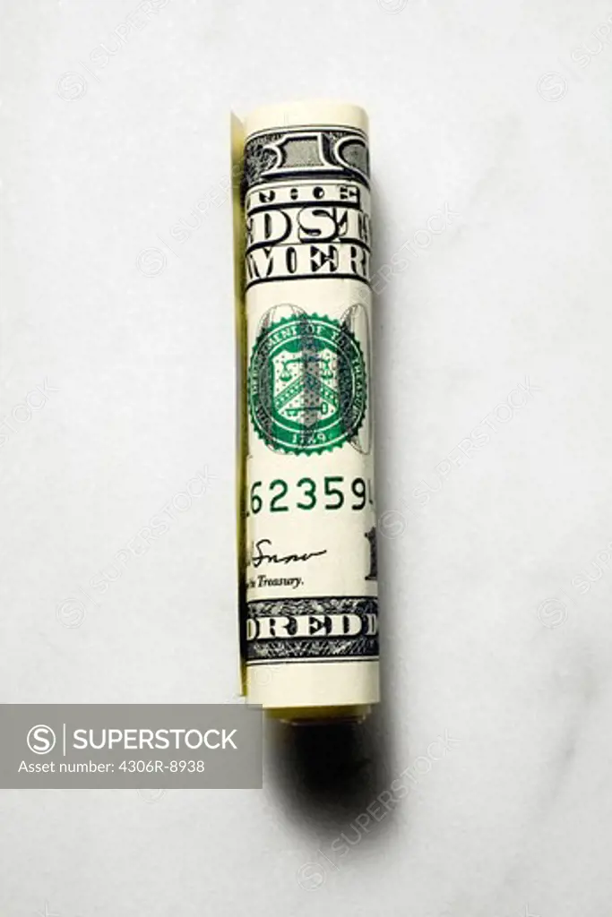 A rolled up dollar bill.