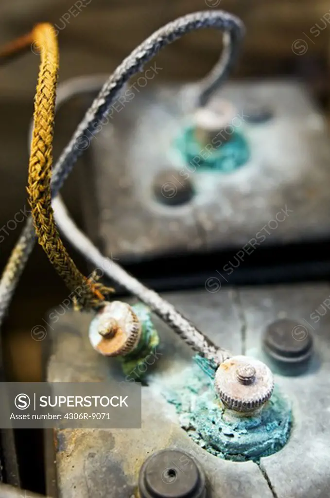 Two worn transistor batteries, close-up.
