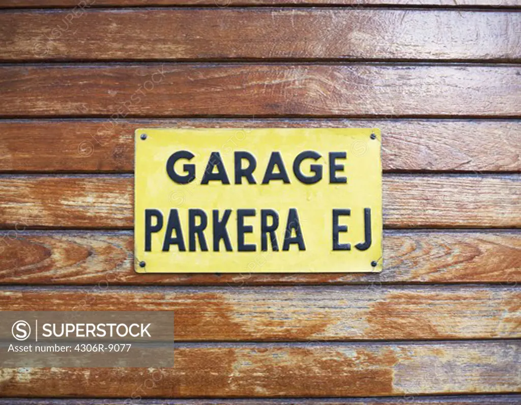 A garage sign forbidding parking.