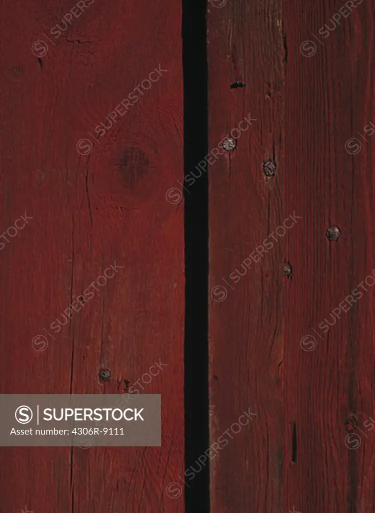 A red wooden wall, close-up.