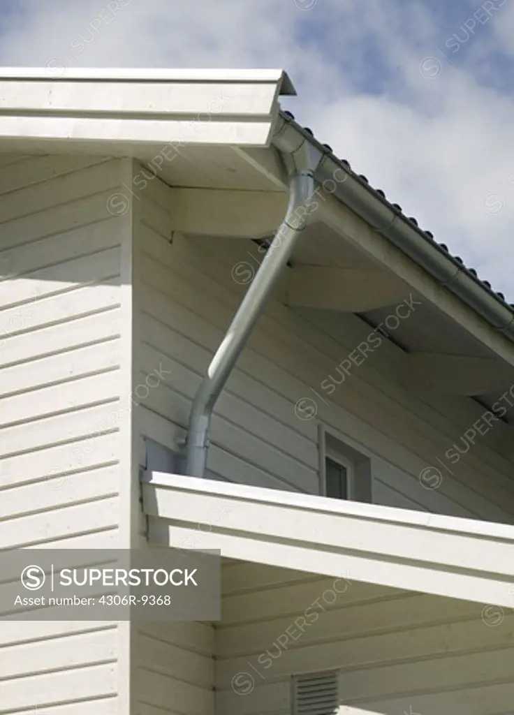 A drainpipe on a house.