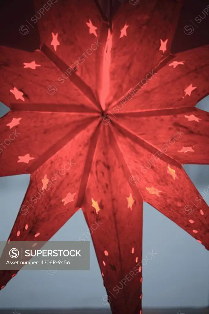 A red Advent star, close-up.