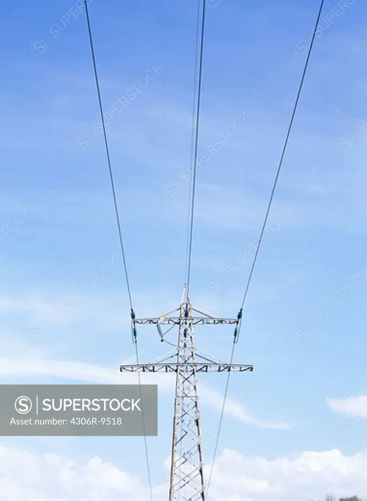 Power line against a blue sky.