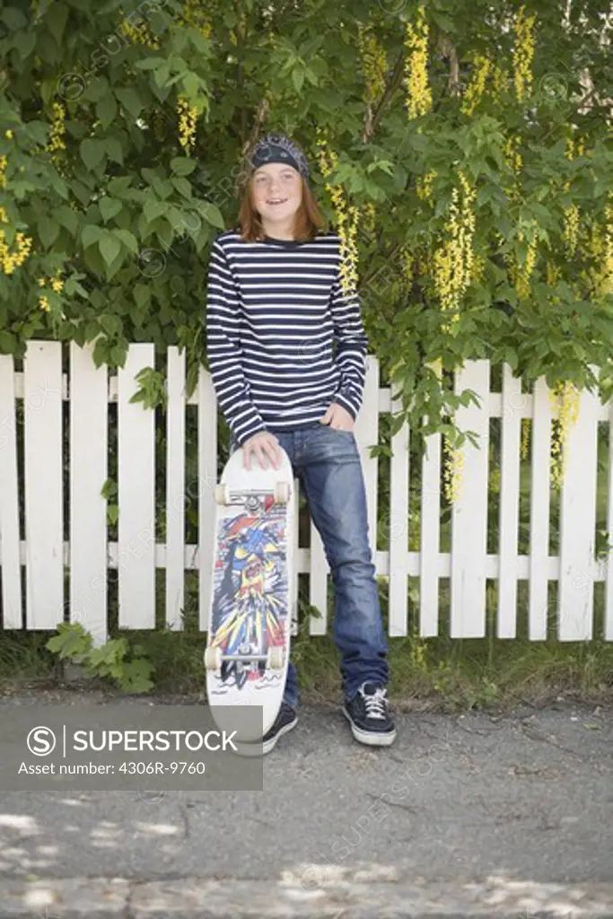 A boy with a skateboard.