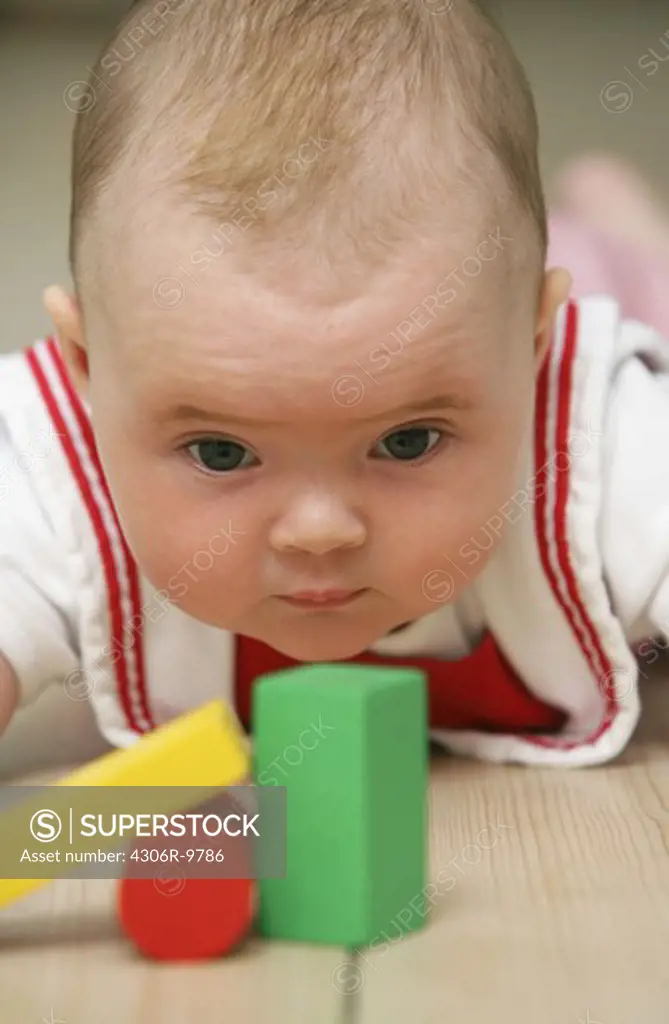 Baby with building blocks.